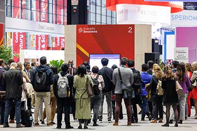 attendees gathered around a booth at Scientific Sessions 2024