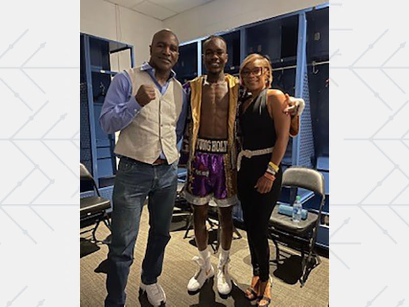Boxer Evan Holyfield (center) with his parents, former heavyweight champion Evander Holyfield and Toi Irvin