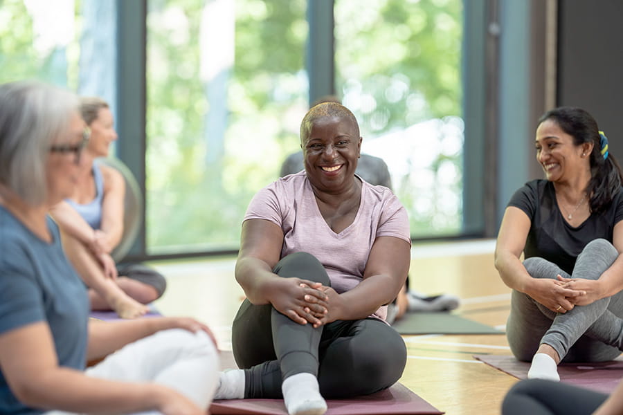 Candid moment of a group sitting after yoga