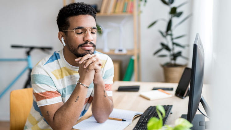 Young man listening to calming sounds